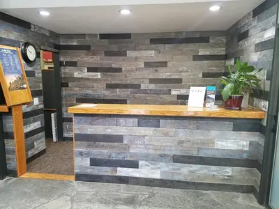 a wall made out of reclaimed wood at Mammoth Ski Racquet Club 62 - Newly Renovated 2025 in Mammoth Lakes