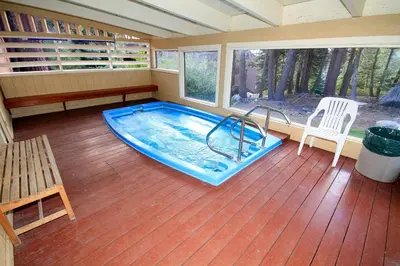 a room with a swimming pool in a house at Mammoth Ski Racquet Club 54 in Mammoth Lakes