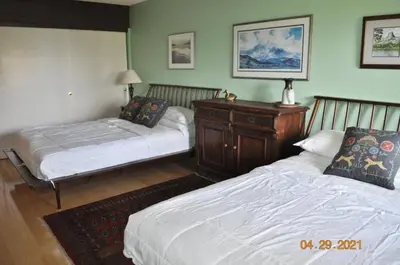 a bedroom with two beds and a dresser at Mammoth Ski Racquet Club 54 in Mammoth Lakes