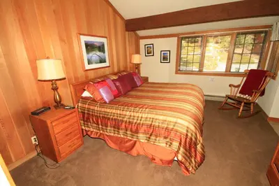 a bedroom with a large bed and a window at Mountainback 115 3 bedroom loft in Mammoth Lakes