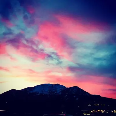 a colorful sky with a mountain in the background at Mountainback 105 Loft Den in Mammoth Lakes