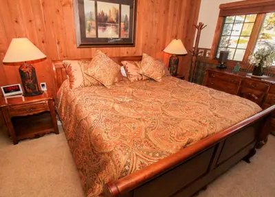 a bedroom with a large bed and two night stands at Mountainback 94 in Mammoth Lakes