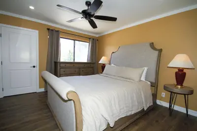 a bedroom with a bed and a ceiling fan at Mammoth Ski Racquet Club 12 - Pet Friendly in Mammoth Lakes