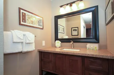 a bathroom with a sink and a mirror at Mammoth Ski Racquet Club 38 - Pet ok - Loft in Mammoth Lakes