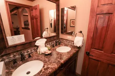a bathroom with two sinks and a large mirror at Mammoth Ski Racquet Club 34 in Mammoth Lakes