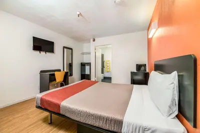 a hotel room with a bed and a desk at Motel 6-Westley, CA in Westley