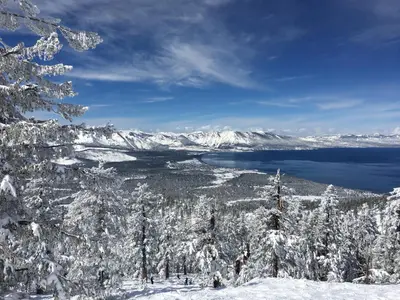 a view of a snow covered mountain and a lake at Black Jack Inn in South Lake Tahoe