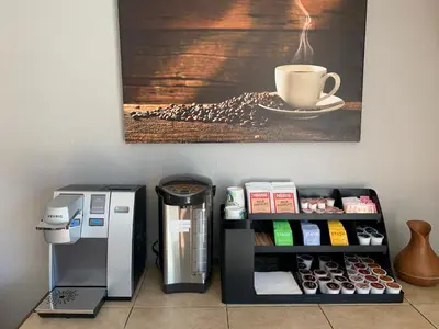 a coffee machine and a coffee cup on a wall at Black Jack Inn in South Lake Tahoe