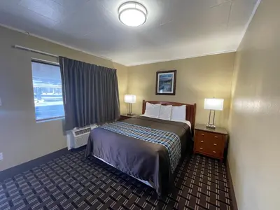 a hotel room with a bed and a window at Tahoe Hacienda Inn in South Lake Tahoe