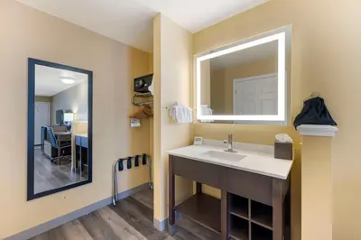 a bathroom with a sink and a mirror at Best Western Fallon Inn & Suites in Fallon
