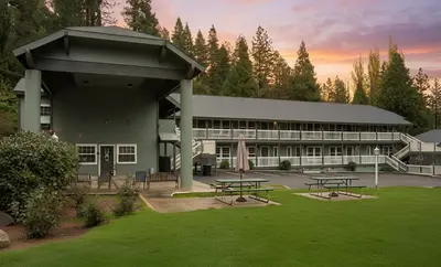 a building with picnic tables in front of it at Westhaven Inn Pollock Pines Camino in Pollock Pines