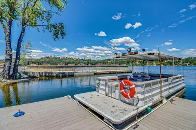 a boat is docked at a dock in the water at Pine Mountain Magic in Groveland