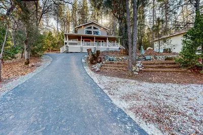 a road leading to a house in the woods at Pine Mountain Magic in Groveland