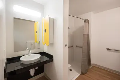 a bathroom with a sink and a shower at Studio 6-Mccarran, NV - Sparks - Tahoe - Reno Industrial Center in Clark