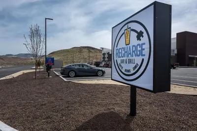 a sign in a parking lot with a car parked at Studio 6-Mccarran, NV - Sparks - Tahoe - Reno Industrial Center in Clark