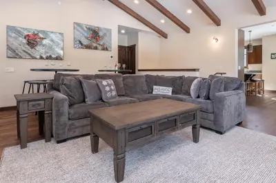 a living room with a couch and a coffee table at Gray Bear 454 in Mammoth Lakes