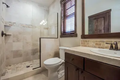 a bathroom with a toilet and a sink and a shower at Gray Bear 454 in Mammoth Lakes
