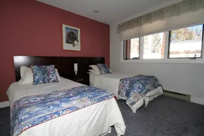 a bedroom with two beds and a window at Mountainback 62 in Mammoth Lakes