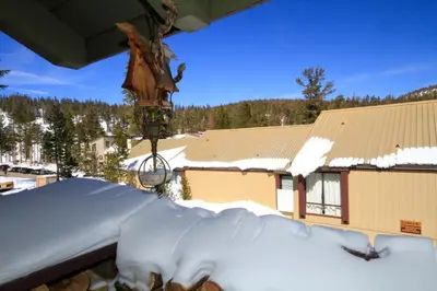 a snow covered roof of a building with a house at Courchevel 51 in Mammoth Lakes