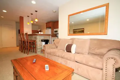 a living room with a couch and a table at Crestview 63 in Mammoth Lakes