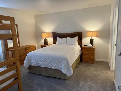 a bedroom with a bed with two night stands and two lamps at Horizons 4 169 2 Bedroom 2 Bath in Mammoth Lakes