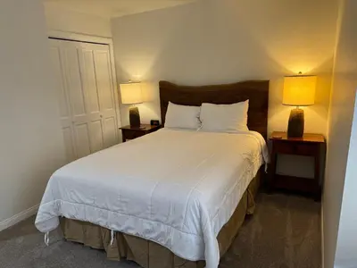 a bedroom with a large bed with two night stands at Horizons 4 169 2 Bedroom 2 Bath in Mammoth Lakes