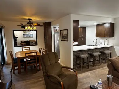 a living room and kitchen with a table and chairs at Horizons 4 169 2 Bedroom 2 Bath in Mammoth Lakes
