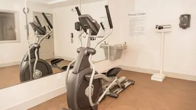 a row of exercise bikes in a gym at Holiday Inn Express Porterville by IHG in Porterville