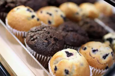 a tray of blueberry muffins in at Holiday Inn Express Porterville by IHG in Porterville