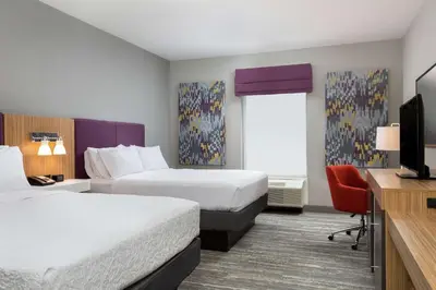a hotel room with two beds and a television at Hampton Inn & Suites Reno/Sparks in Reno