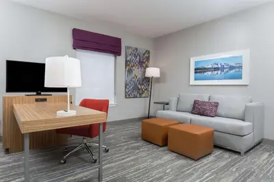 a living room with a couch and a table at Hampton Inn & Suites Reno/Sparks in Reno