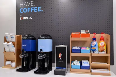 a coffee shop with a coffee machine on a table at Holiday Inn Express Lodi by IHG in Lodi
