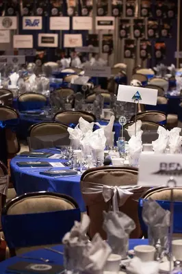 a dining room with blue tables and chairs at Carson Valley Motor Lodge and Suites in Minden