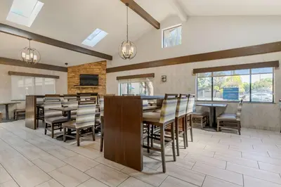a large dining room with tables and chairs at Best Western Plus Forest Park Inn in Gilroy