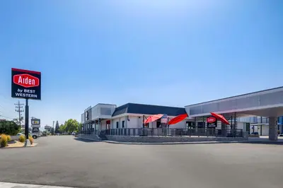 an empty parking lot in front of a store at Aiden by Best Western South Reno in Reno