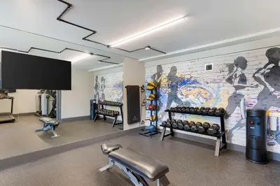 a gym with a wall with a mural at Aiden by Best Western South Reno in Reno