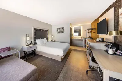 a hotel room with a bed and a desk at Aiden by Best Western South Reno in Reno