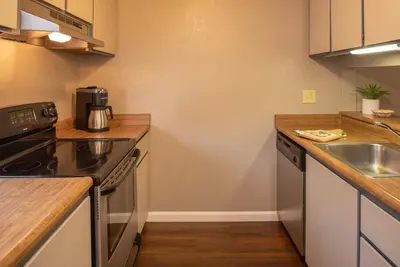 a kitchen with a sink and a stove at Thunderbird Resort Club in Reno