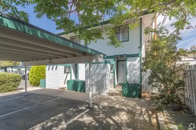 a building with an overpass in a parking lot at Thunderbird Resort Club in Reno