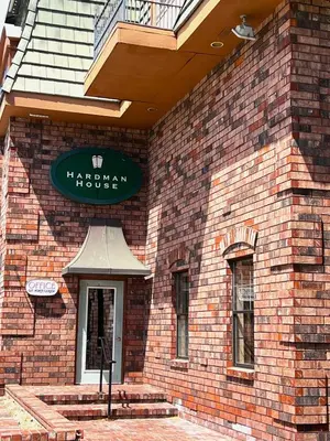 a brick building with a sign on the side of it at Hardman House in Carson City