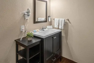 a bathroom with a sink and a mirror at Buck Meadows Lodge in Groveland