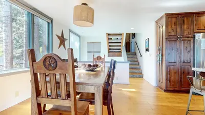 a dining room with a table and chairs at Bridges Townhome #11 Townhouse in Mammoth Lakes
