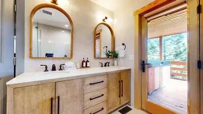 a bathroom with a sink and a mirror at Bridges Townhome #11 Townhouse in Mammoth Lakes