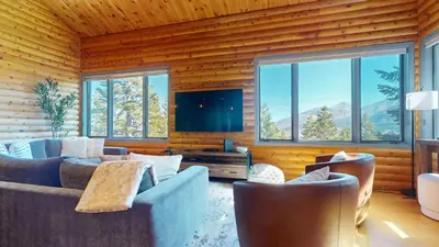 a living room with two couches and a flat screen tv at Bridges Townhome #11 Townhouse in Mammoth Lakes