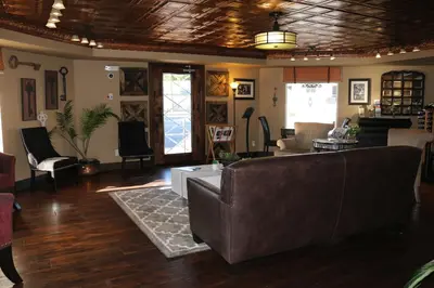 a living room with a couch and a table at Historian Inn in Gardnerville
