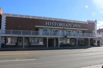 a brick building with a sign that reads historian inn at Historian Inn in Gardnerville