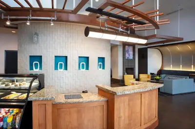a kitchen with a counter in a restaurant at Hyatt Place Reno/Tahoe Airport in Reno
