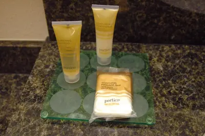a group of three bottles of sunscreen on a counter at Hyatt Place Reno/Tahoe Airport in Reno