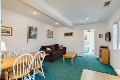 a living room with a couch and a table and chairs at Jumping Deer in Yosemite West