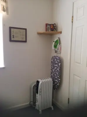 a room with a radiator next to a door at Jumping Deer in Yosemite West